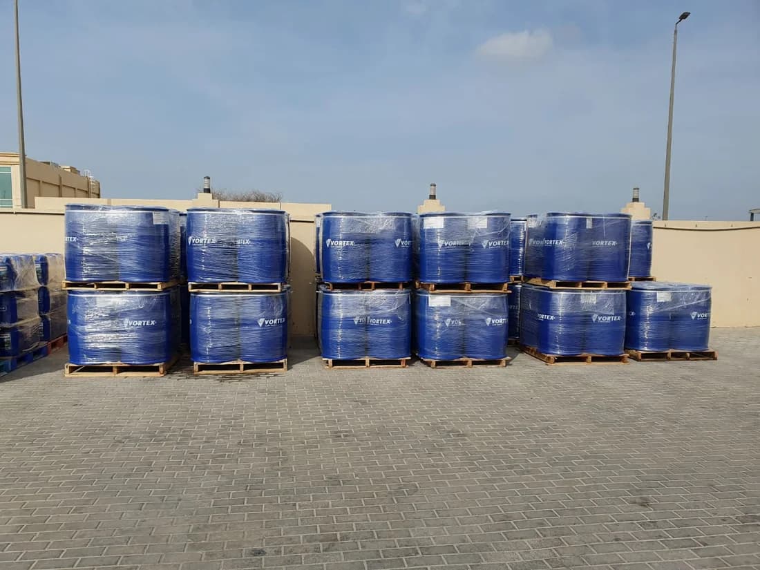 Pallets of blue Vortex drums in the yard